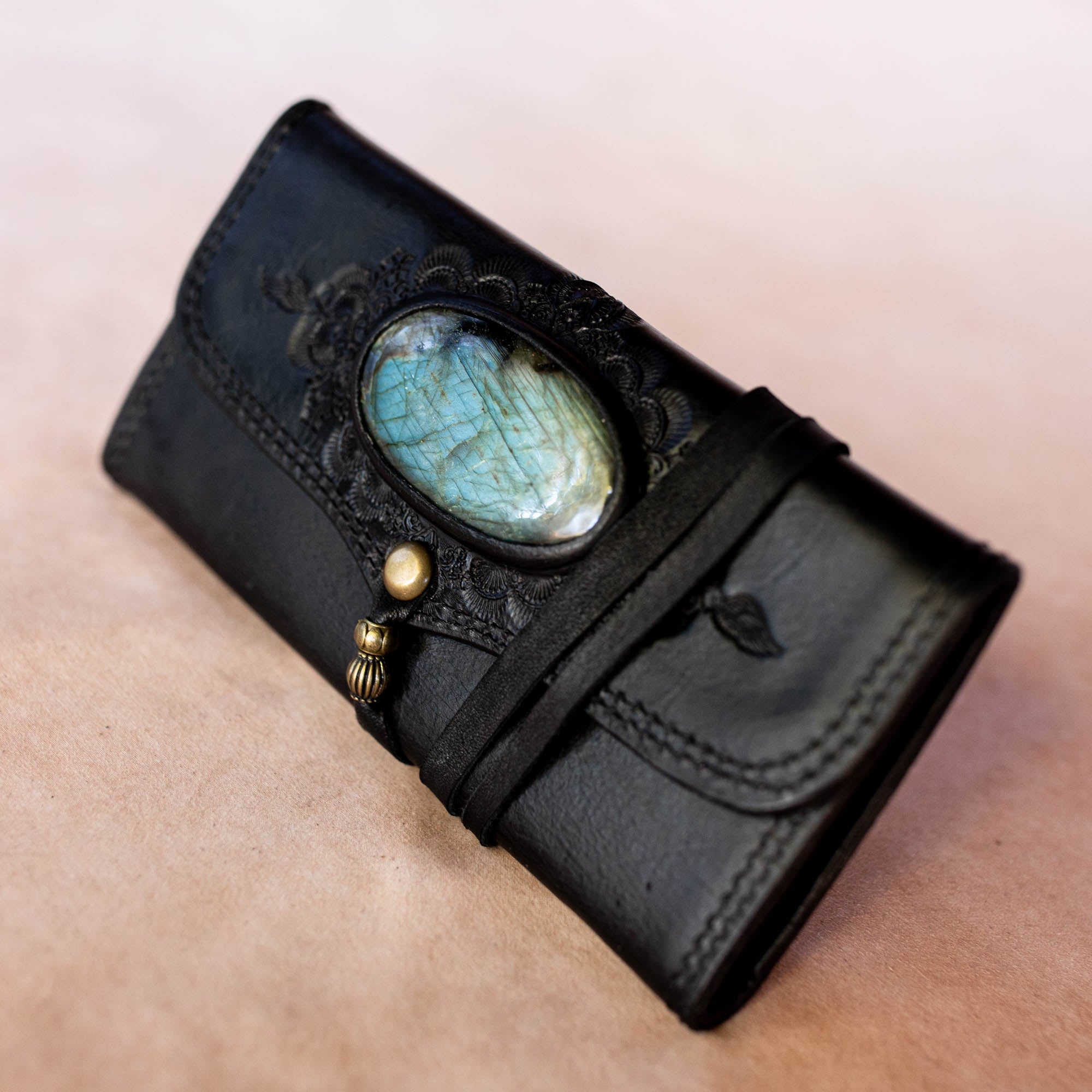 Black leather wallet with turquoise stone and gold accents 